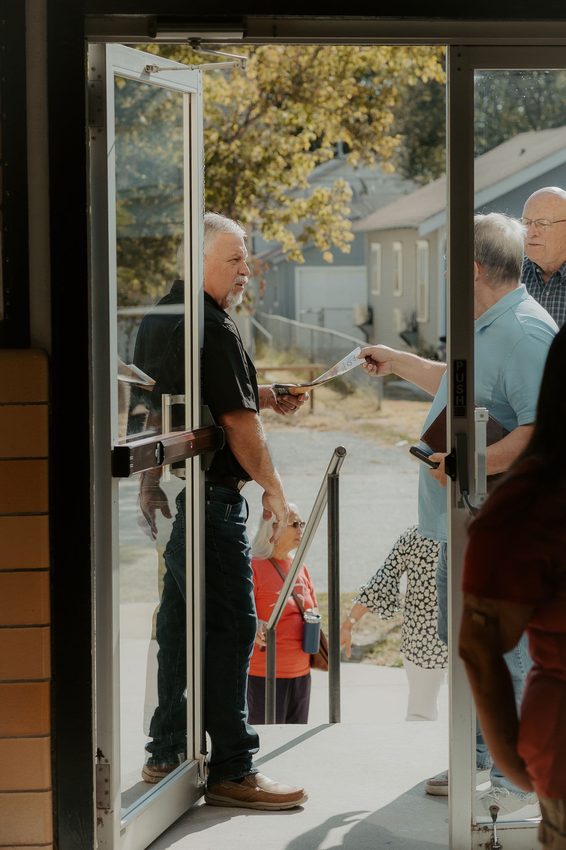 Church family arriving at Calvary Chapel Arkansas City